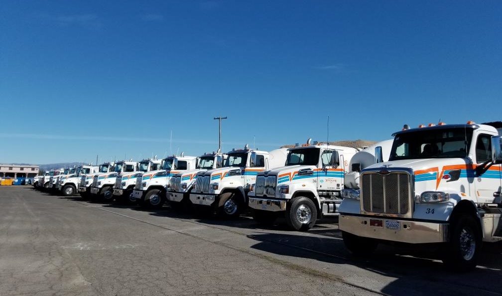 A fleet of Northgate trucks lined up in parking lot
