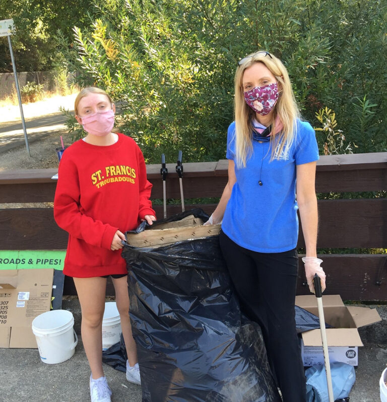 Carolyn and her daughter participate in the American River Conservancy’s clean-up day.