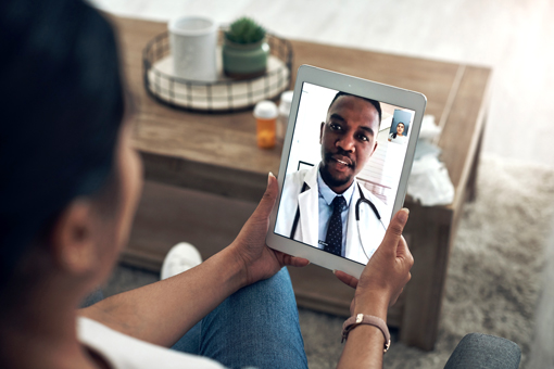 patient in videocall with doctor on a tablet.